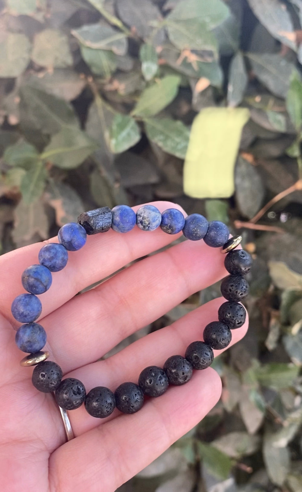 Raw black tourmaline, lapis lazuli, lava beads, and pyrite